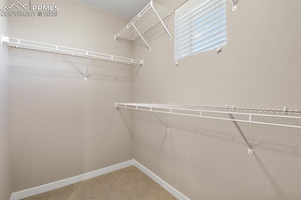 Image 21 of 34: Primary Suite Walk-In Closet