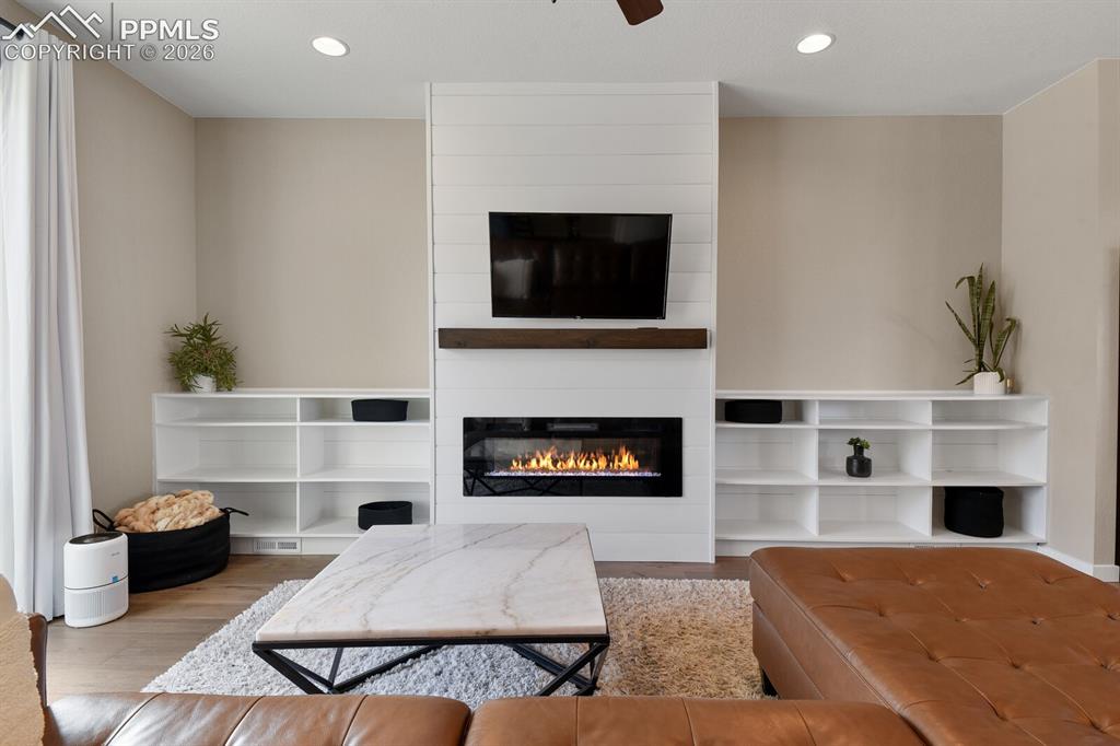 Image 5 of 35: Beautiful Built-In Fireplace & Bookshelves