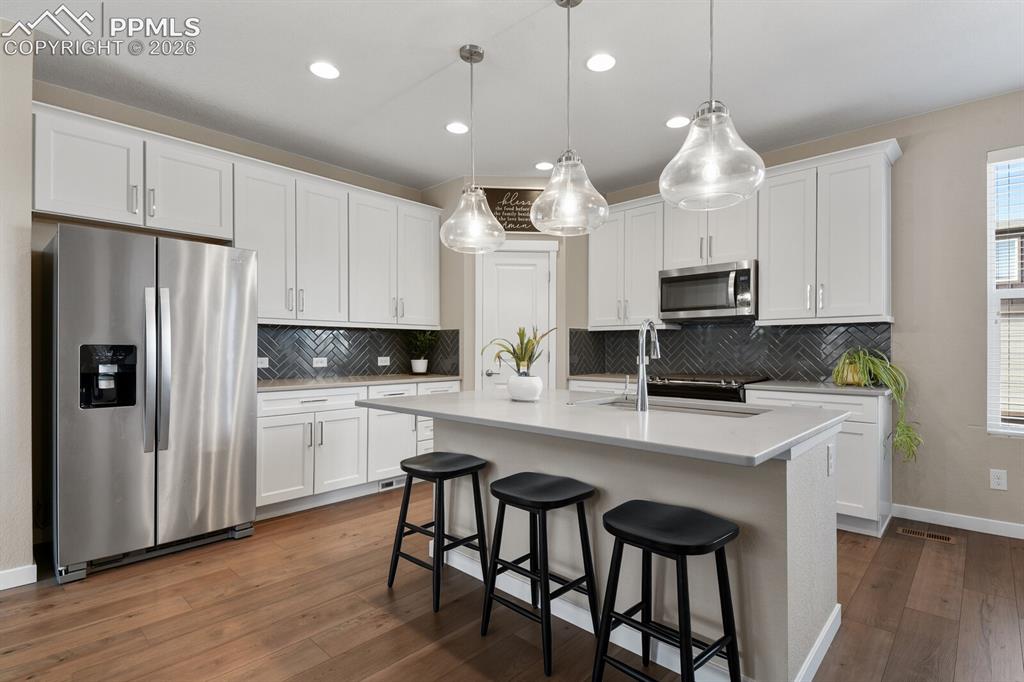 Image 6 of 35: Kitchen With Stainless Appliances