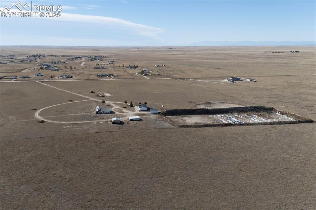 Image 39 of 40: Aerial view of property and surrounding area featuring rural landscape and