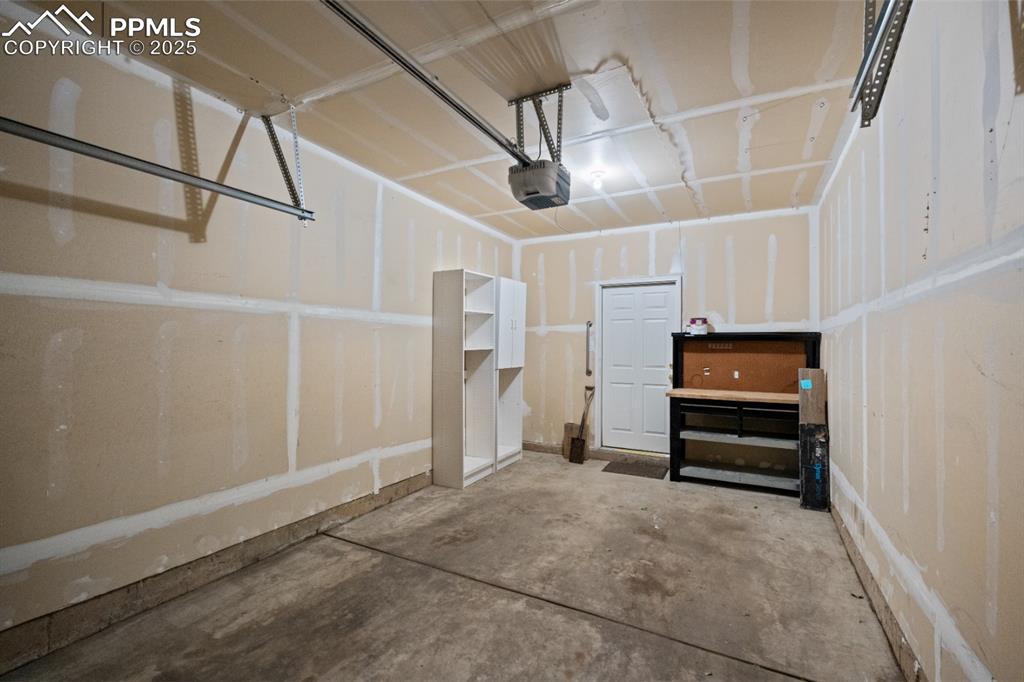 Image 21 of 22: Garage with a garage door opener