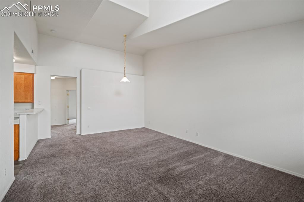 Image 9 of 22: Unfurnished room with carpet floors