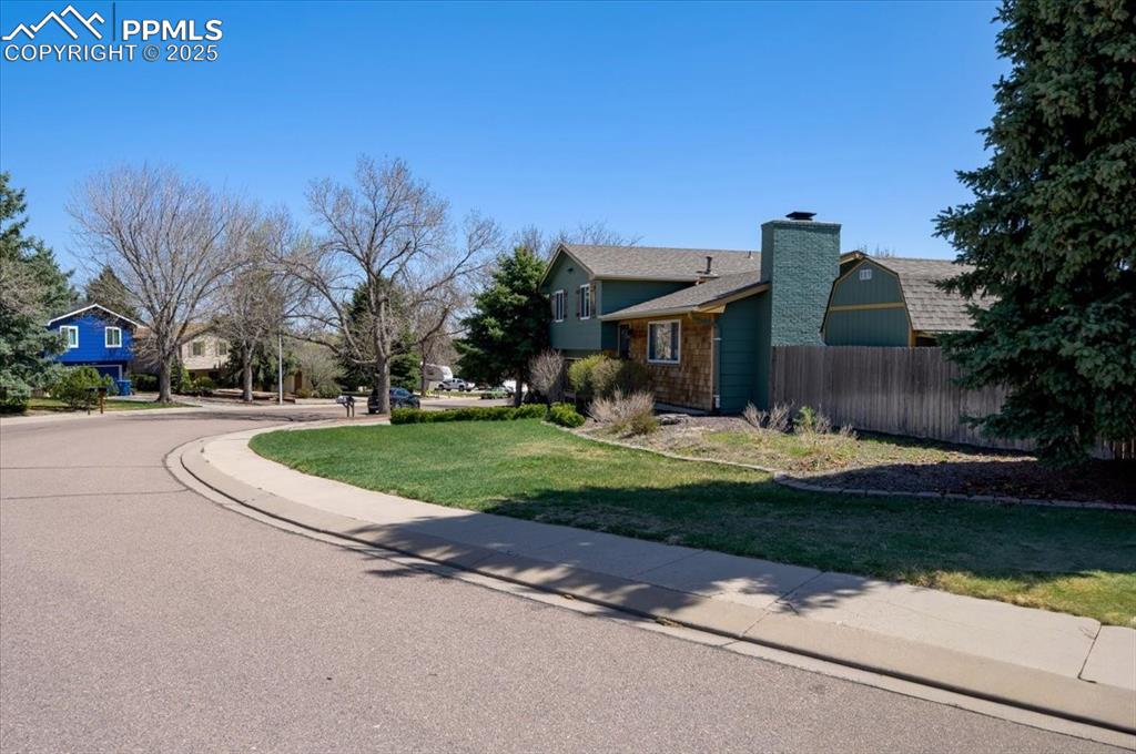 Image 39 of 41: View of street with sidewalks and curbs