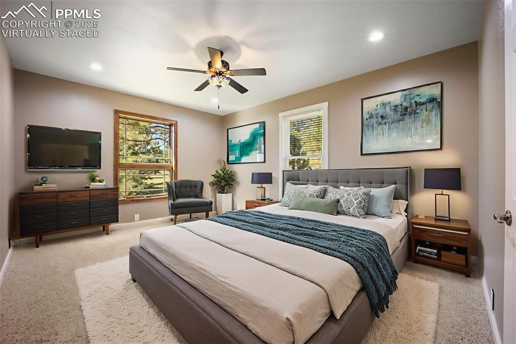 Image 38 of 50: Virtually Staged Carpeted bedroom featuring a ceiling fan and recessed ligh