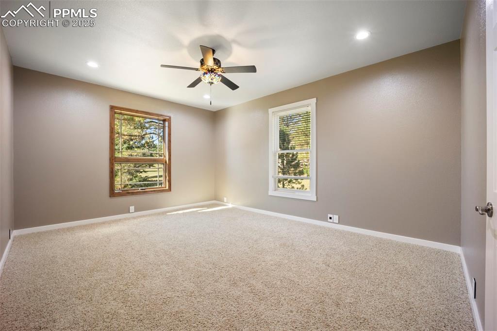 Image 39 of 50: Unfurnished room with carpet floors, recessed lighting, and ceiling fan