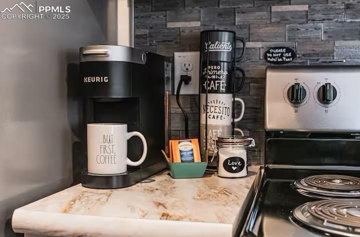 Image 8 of 26: Kitchen view of stainless steel stove