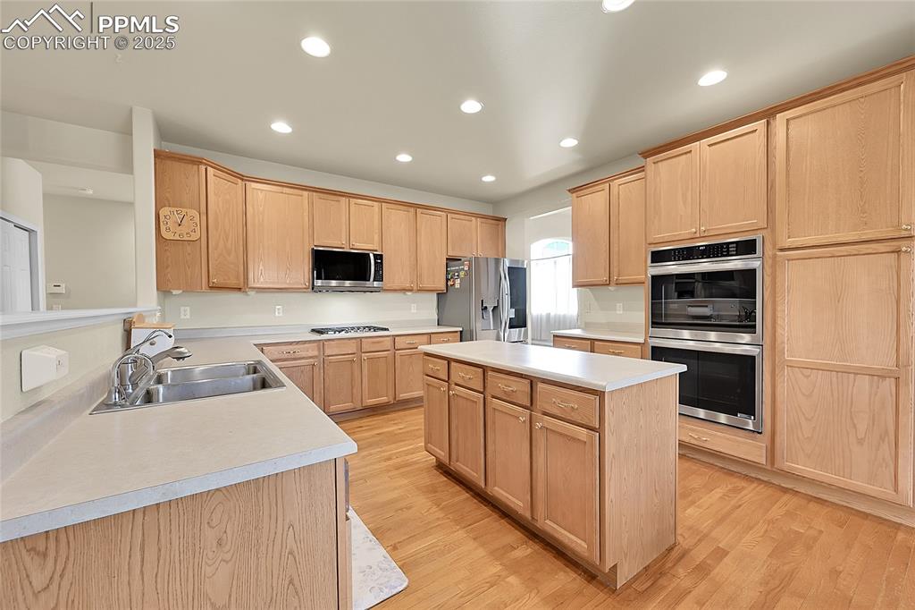 Image 12 of 44: Kitchen featuring light wood-style flooring, recessed lighting, a kitchen i