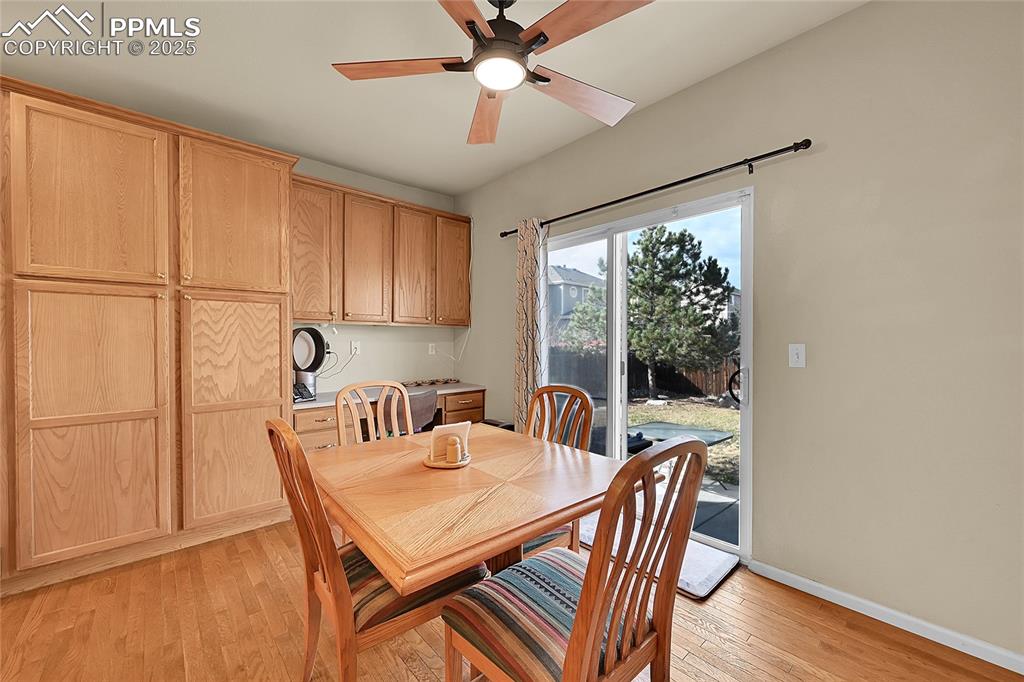 Image 14 of 44: Dining room featuring light wood-type flooring and a ceiling fan