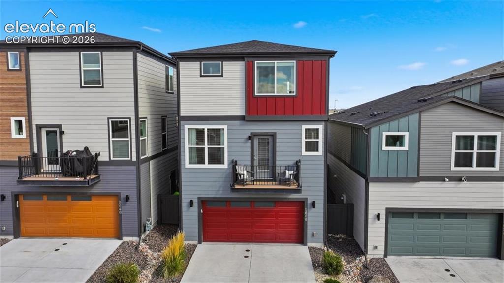 Image 5 of 25: Street view of the home showing one of two decks!
