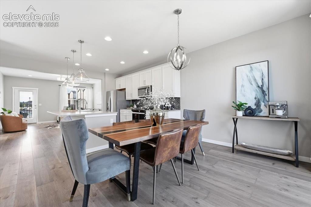Image 9 of 25: Large dining room opens to kitchen!