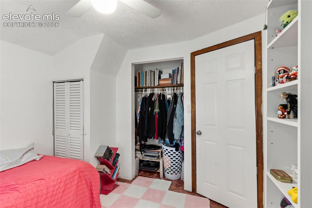 Image 15 of 29: White ceiling fan with light fixture