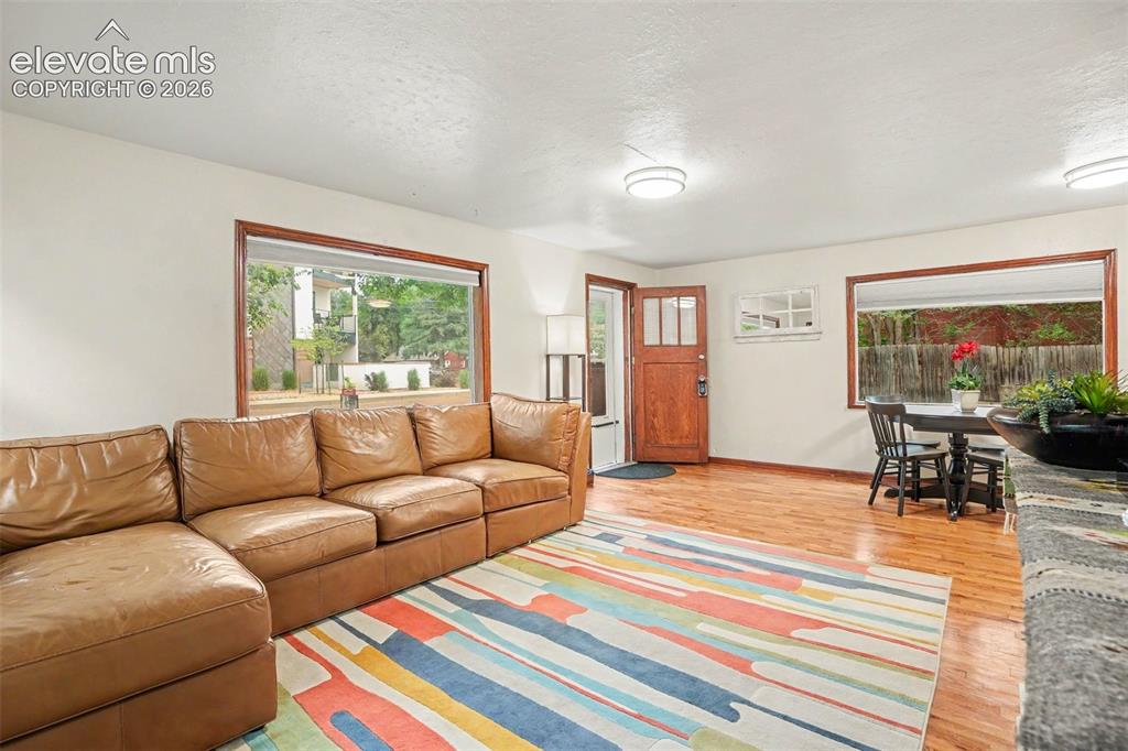 Image 3 of 24: Light and bright living room with real oak hardwood floors.