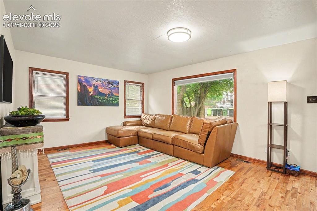 Image 4 of 24: Numerous windows fill the home with natural light, creating a bright, invit