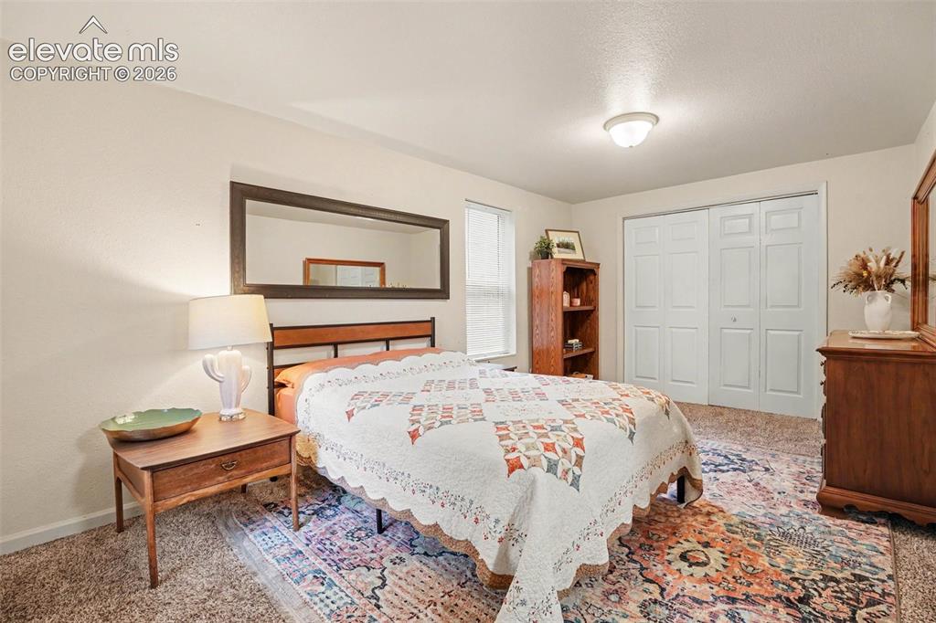Image 9 of 24: Private master bedroom is tucked away and private