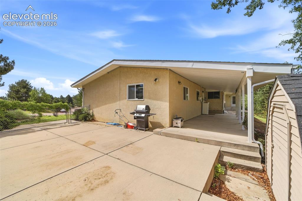 Image 31 of 43: side yard parking area
