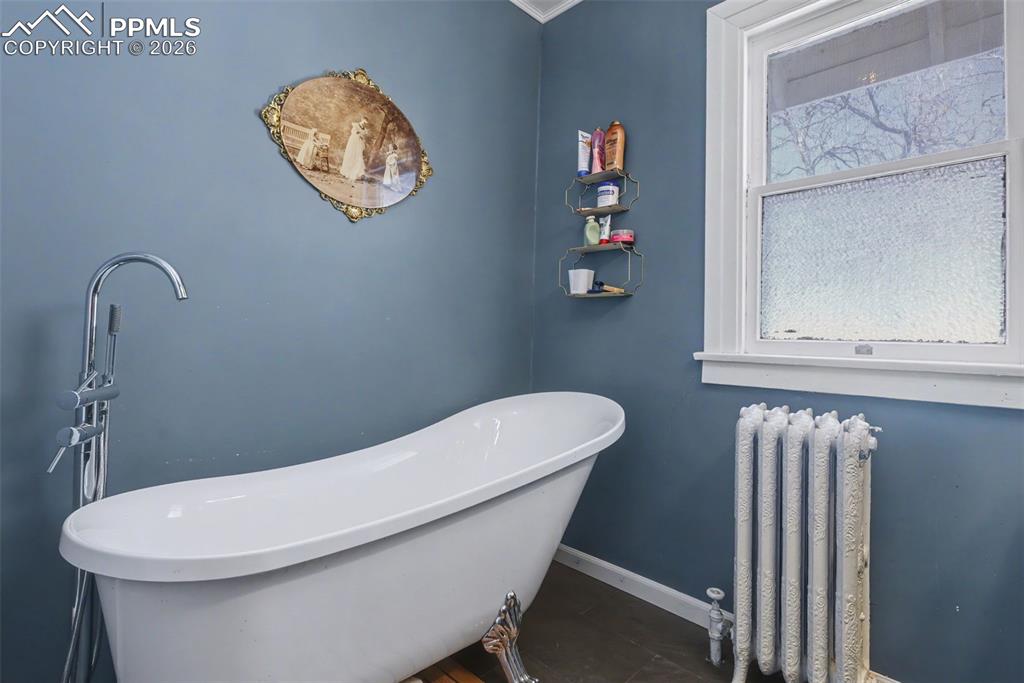 Image 28 of 46: Upper level bathroom with clawfoot tub
