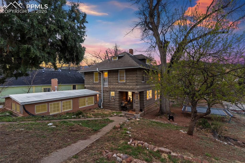 Image 7 of 43: View of back of main house and studio