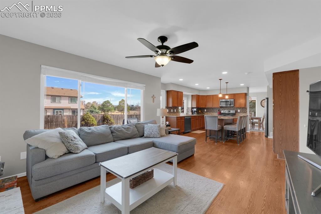 Image 12 of 39: Living room with walk out to backyard