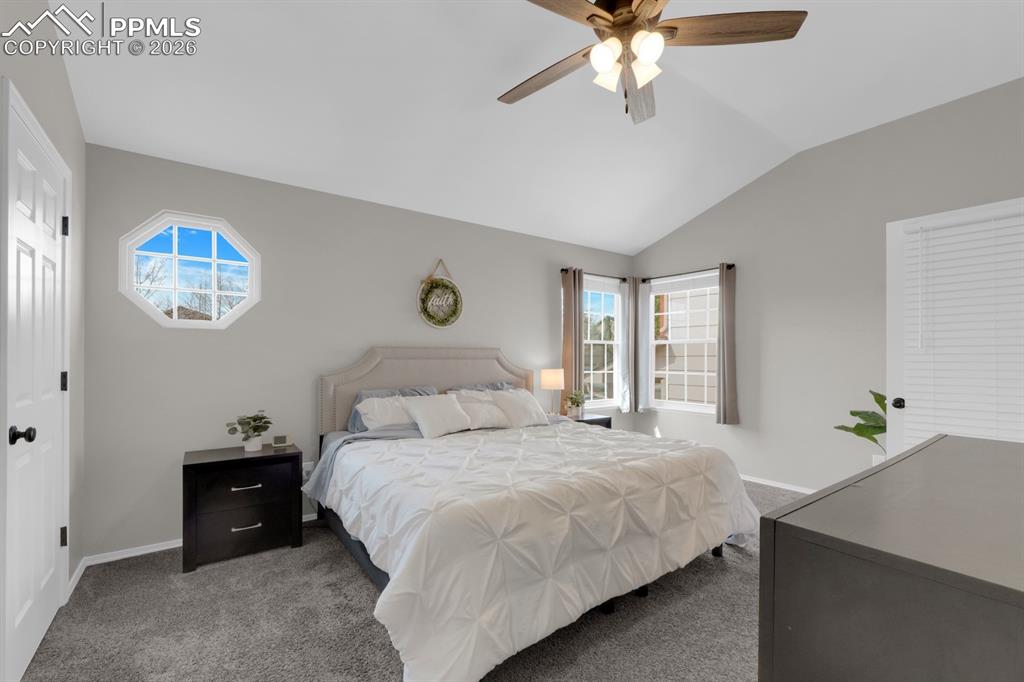 Image 15 of 39: Primary Bedroom -Vaulted ceilings
