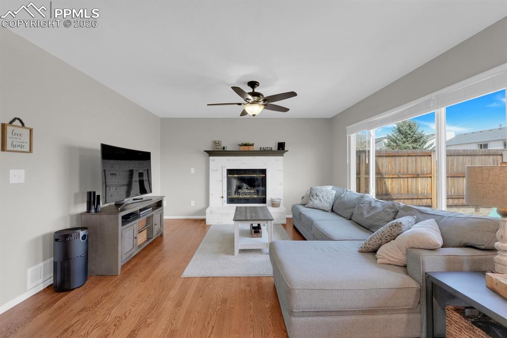 Image 3 of 39: Living Room-gas fireplace & real wood floors