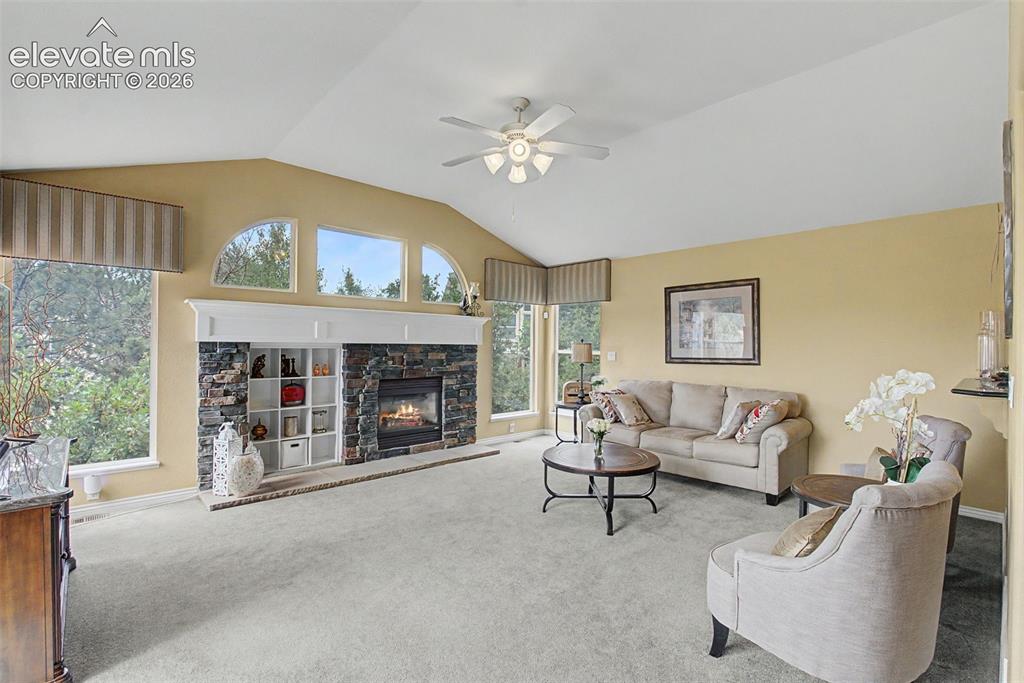 Image 16 of 50: Beautiful Stone Fireplace with Built in Display Niche!