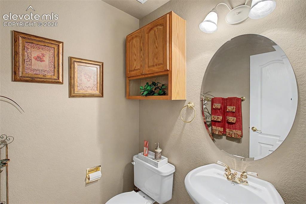 Image 20 of 50: Main Level Powder Room!