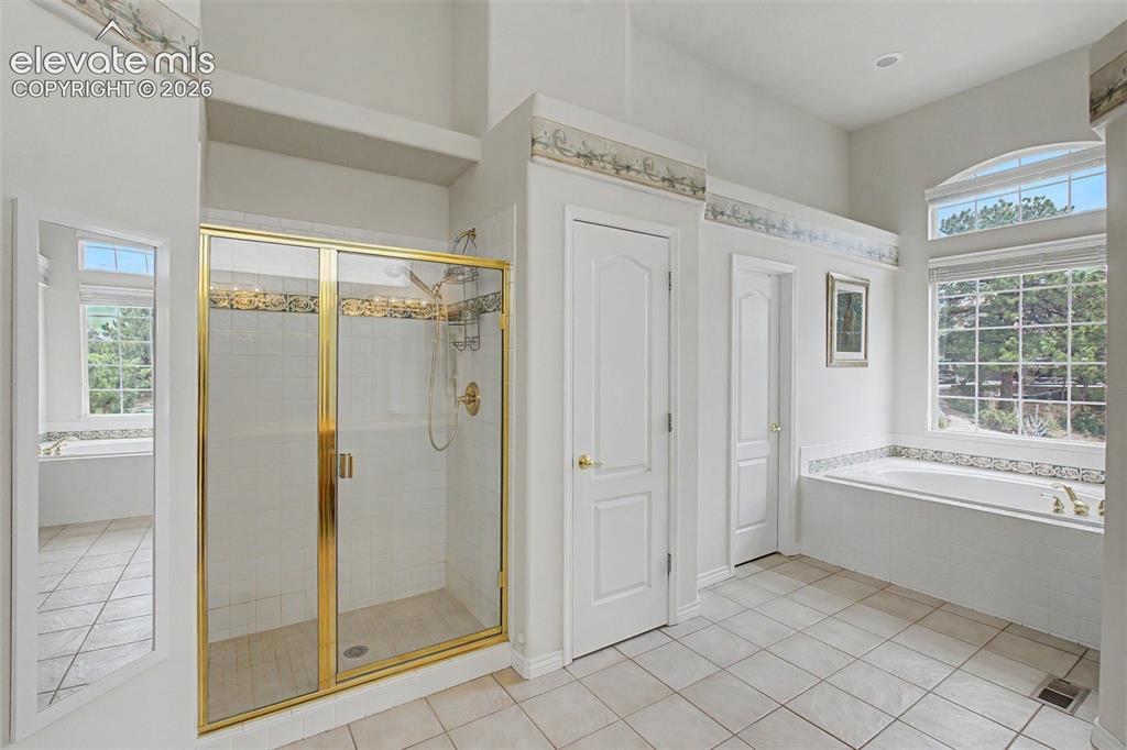 Image 24 of 50: Spa Like Primary Bathroom with Dual Walk-in Closets!