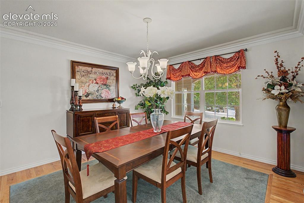 Image 6 of 50: Beautiful Hardwood Floors with Custom Carpet Inlay!