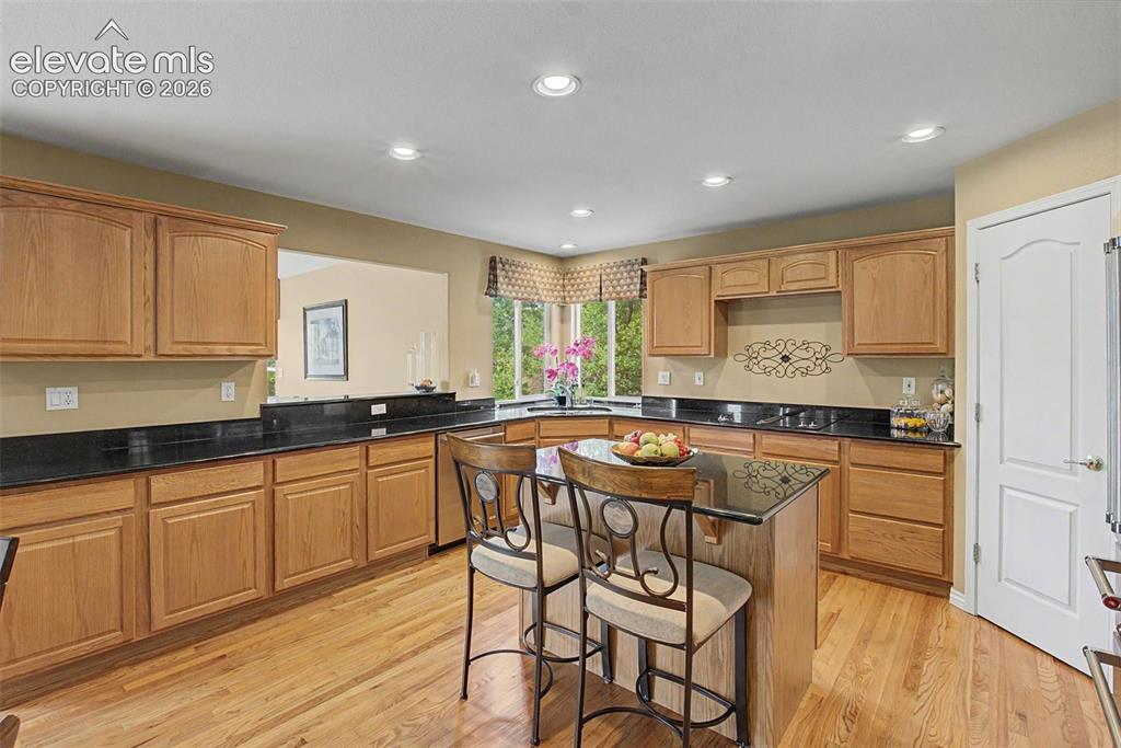 Image 9 of 50: Granite Countertops and an Abundance of Cabinets!