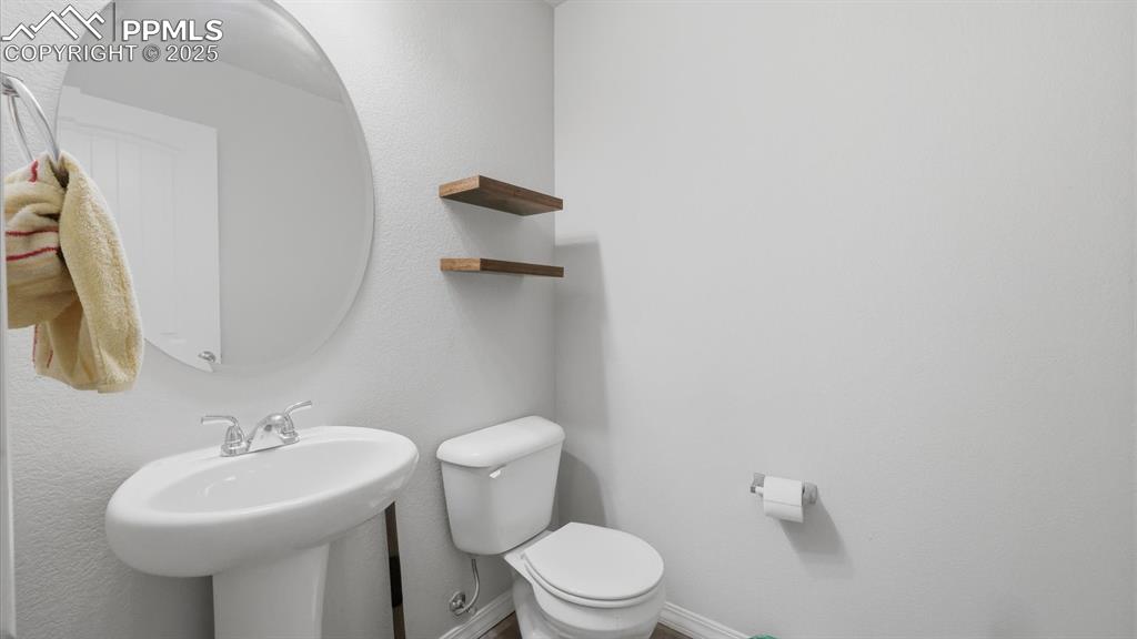 Image 10 of 36: Convenient Powder Bathroom for guests.