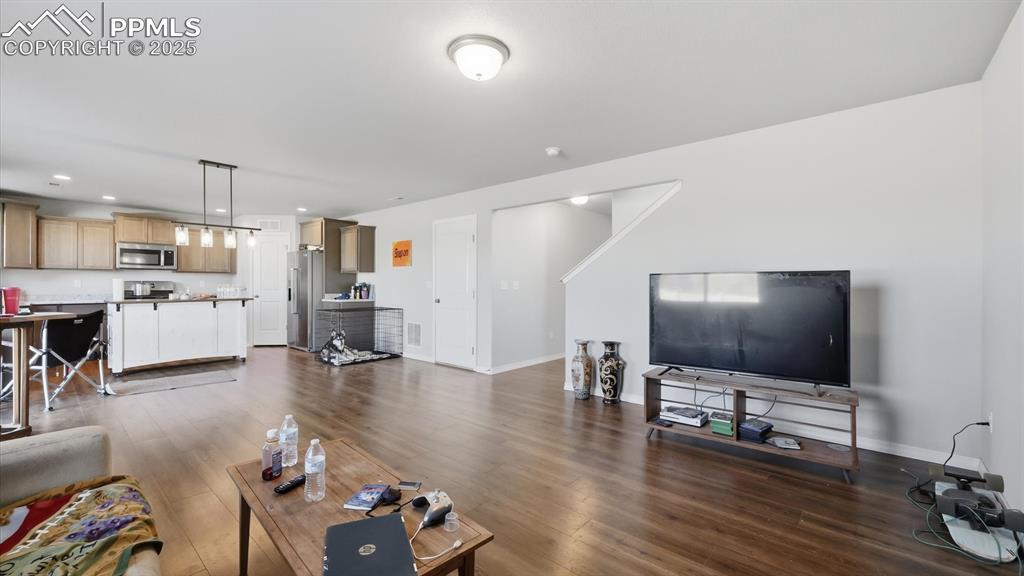 Image 12 of 36: Open floor plan with spacious Living Room that flows seamlessly into the Di