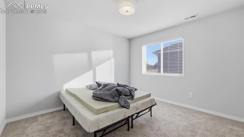 Image 24 of 36: Bedroom #3 has neutral carpet.
