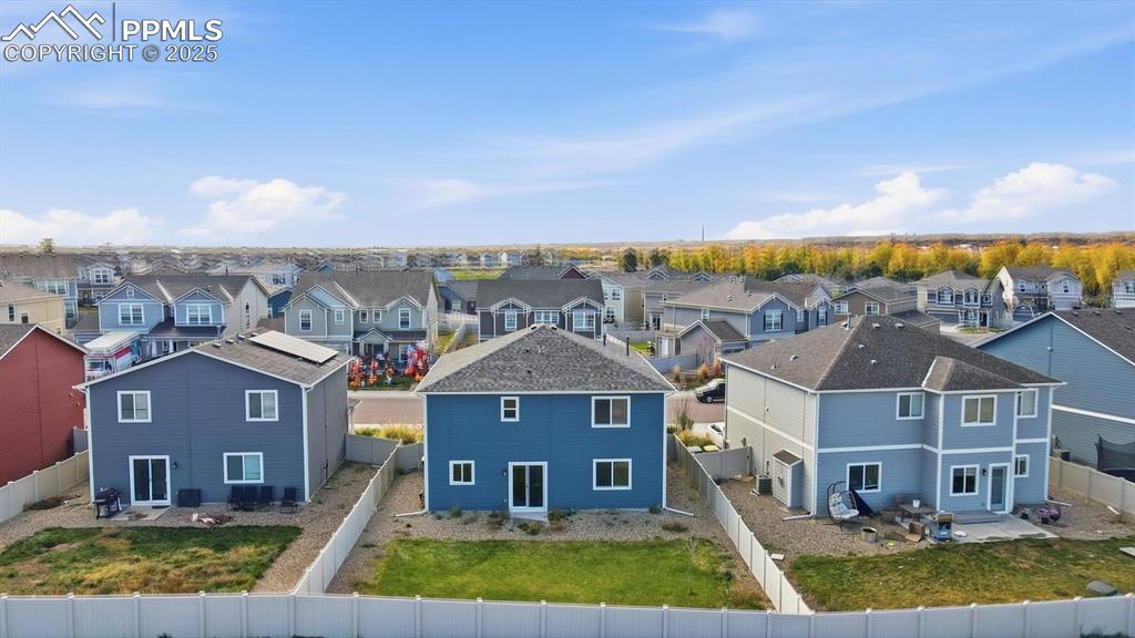 Image 31 of 36: Aerial rear view of home and backyard.