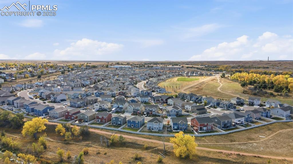 Image 36 of 36: Aerial view of the community, open space, and walking trails.