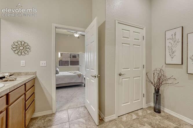 Image 14 of 42: Large linen closet just off of the walk-in closet