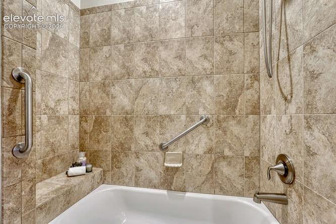 Image 15 of 42: Primary Tub/Shower combo off of the Primary bedroom