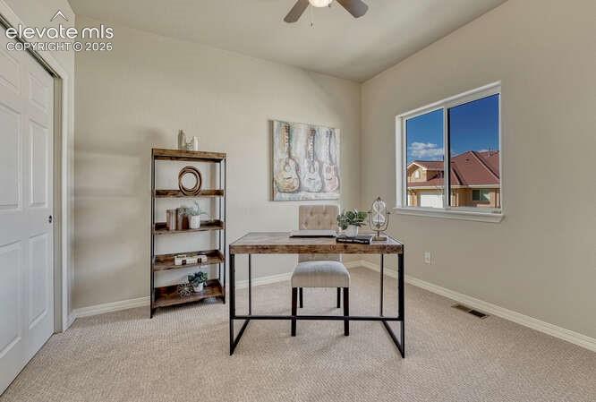 Image 17 of 42: Main level bedroom #2 is located in the front of the house and could be use