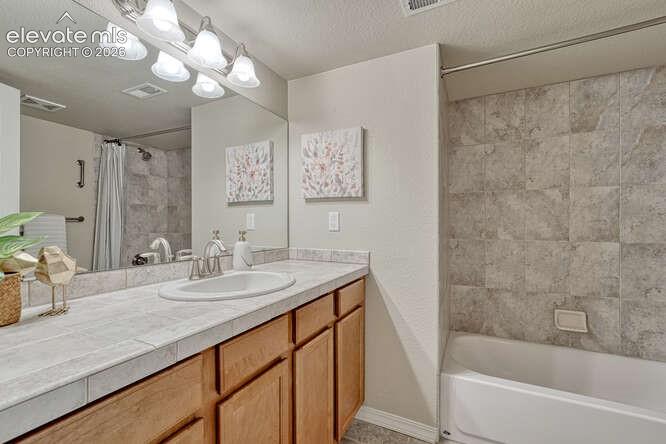 Image 25 of 42: Full basement bathroom complete with a Shower/Tub combo