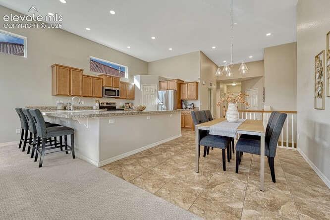 Image 35 of 42: Kitchen area with plenty of natural light and new lighting!