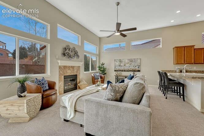 Image 8 of 42: An abundance of windows creates a light and cozy living room.