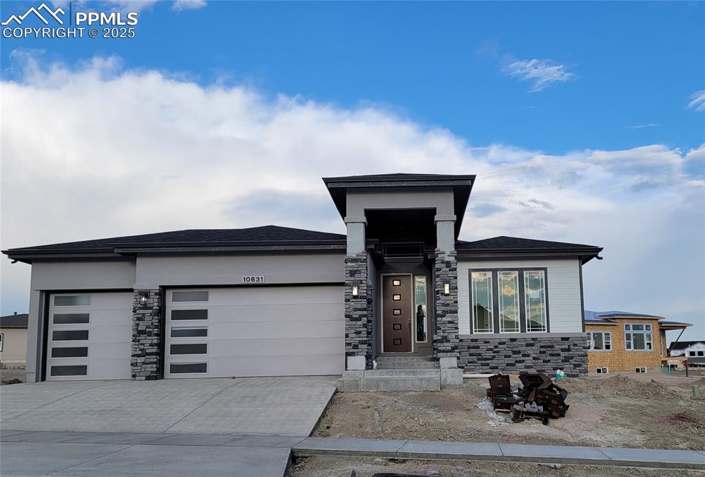 Caption: Falkirk-Ranch Plan-Prairie Elevation-3 Car Garage-Finished Basement with 9