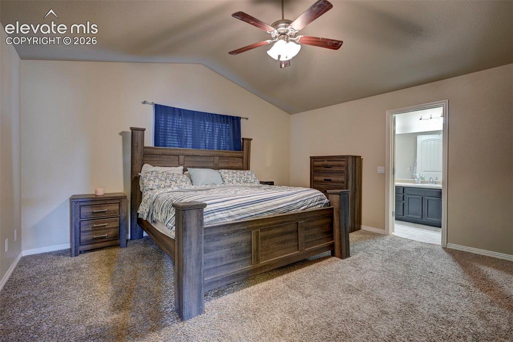 Image 34 of 45: Vaulted ceiling with a ceiling fan