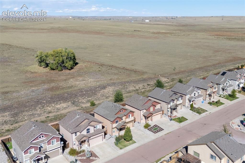 Image 6 of 45: Residential street with multiple single-family homes featuring attached gar