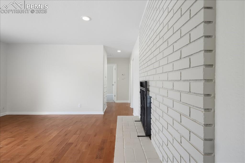 Image 4 of 22: Corridor with light wood-style flooring and recessed lighting