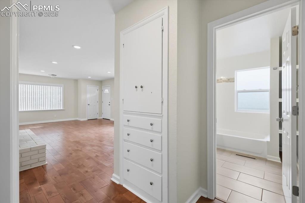 Image 6 of 22: Hall featuring light wood-style floors and recessed lighting