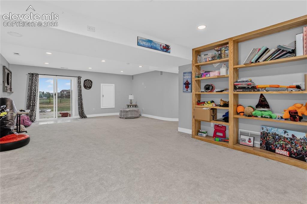 Image 21 of 29: Walk-out family room w/ surround sound - lower level