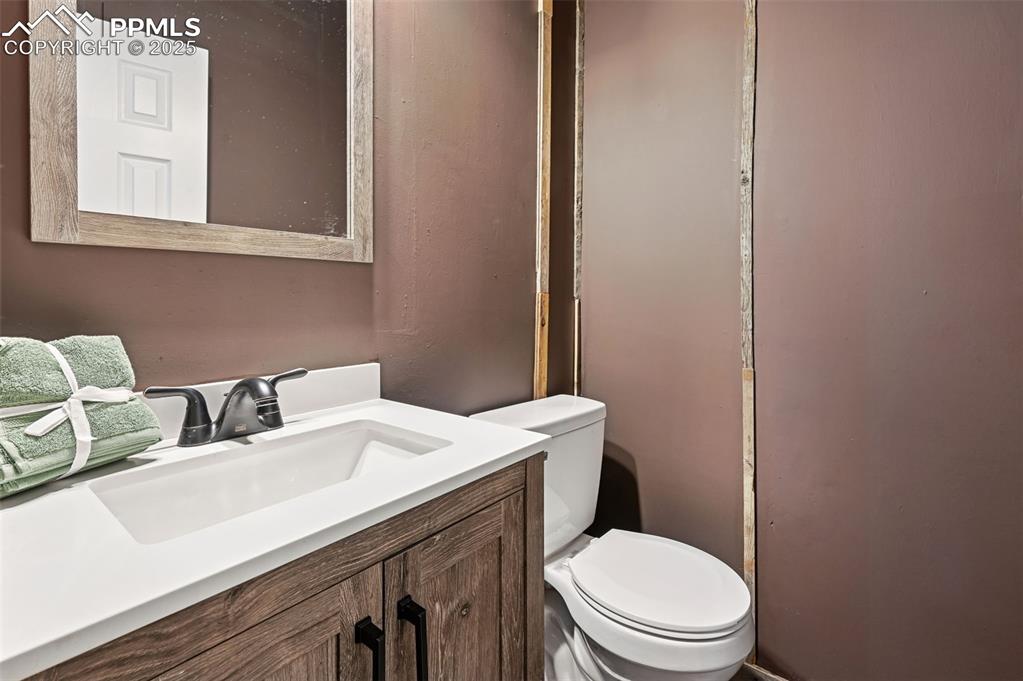 Image 13 of 50: Powder room off laundry