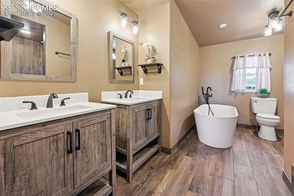 Image 23 of 50: Primary double vanity