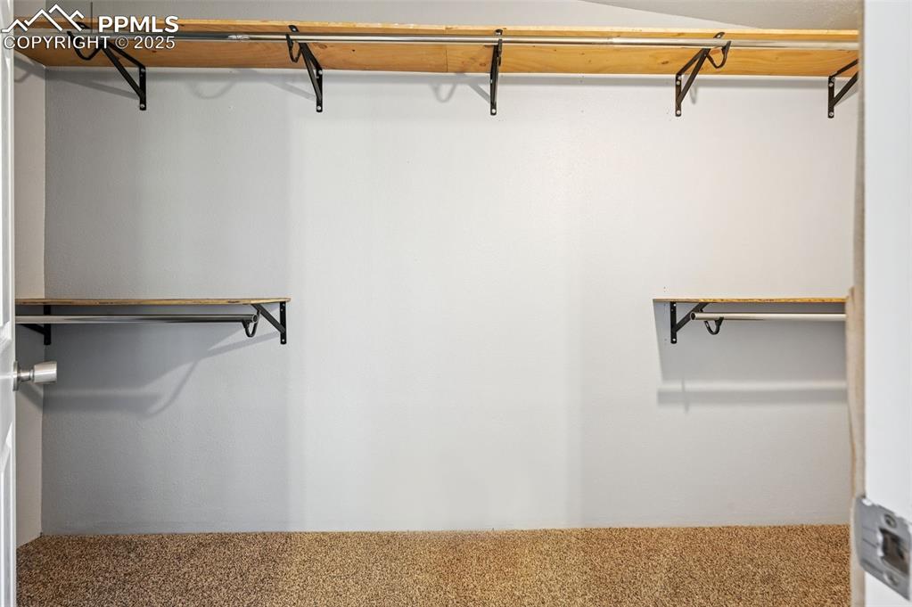 Image 24 of 50: Primary walk-in closet