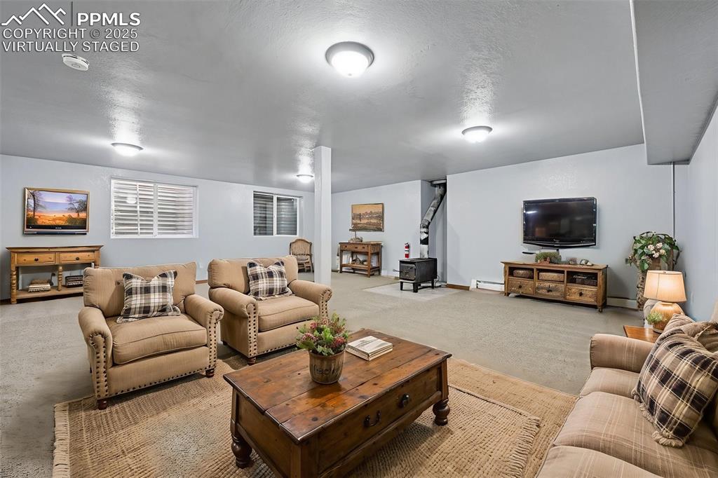 Image 33 of 50: Large Basement bonus rooms/family rooms virtually staged